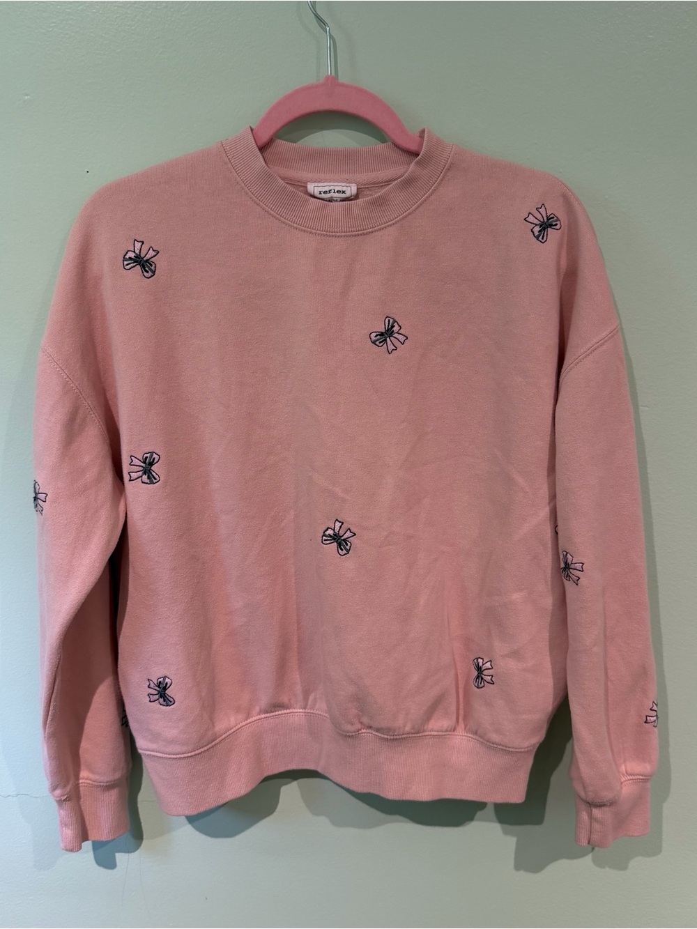 Reflex Pink Crewneck Sweater with Embroidered Bow Motifs